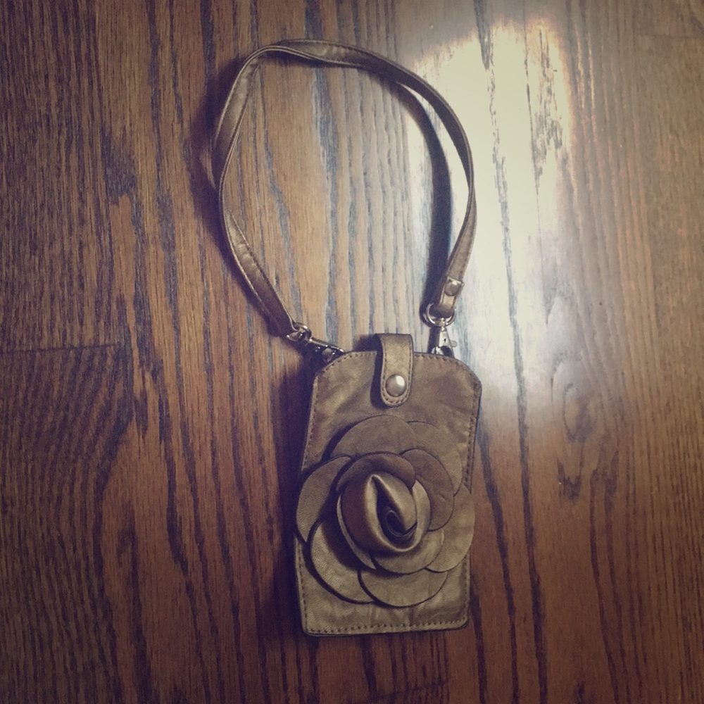 Never used Golden colored flower wristlet